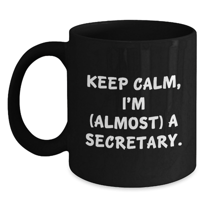 Funny Secretary Gifts, Keep Calm I'm (Almost) A Secretary Black Coffee Mug for Birthday, Gifts from Friends, Black Coffee Mug for Secretary, Secretary Lover Black / 11oz