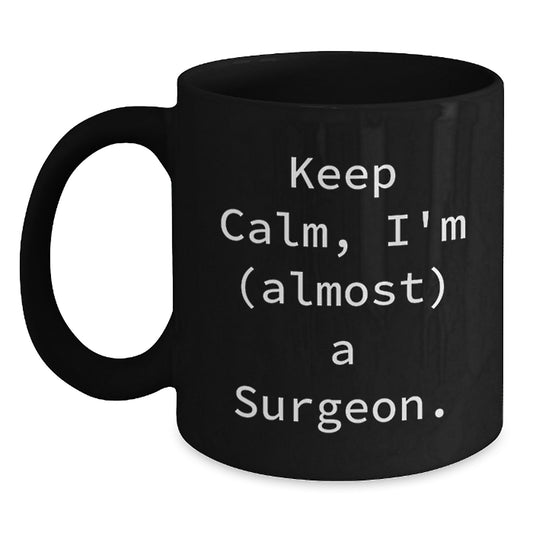 Funny Surgeon Gifts from Friends for Birthday Unique Mugs - Keep Calm I'm (almost) A Surgeon. Black Coffee Mug for Men and Women - Main