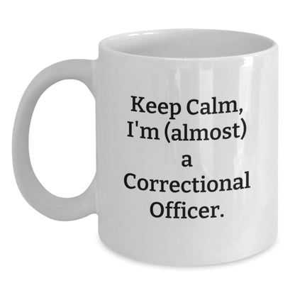 Funny Correctional Officer Gifts, White Coffee Mug, 'Keep Calm, I'm (almost) A Correctional Officer.' - Main