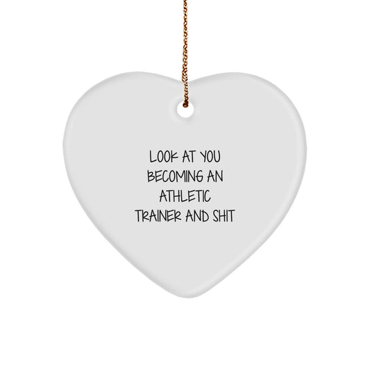 Funny Athletic Trainer Gifts from Friends - Heart Ornament for Men or Women, Christmas Unique Presents for Him or Her, Look At You Becoming An Athletic Trainer And Shit - Image 1